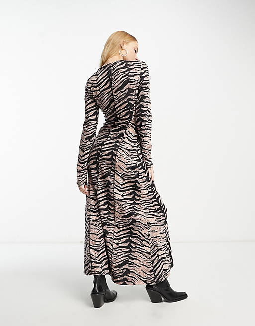 ASOS DESIGN long sleeve rib midi dress with contrast stitch detail in animal print